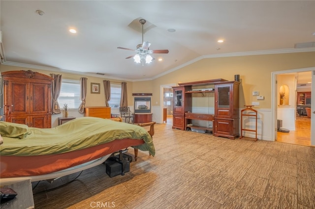 bedroom featuring crown molding, ceiling fan, and lofted ceiling