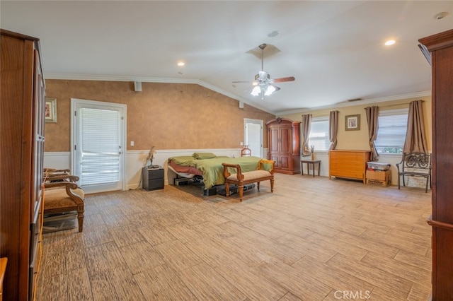 bedroom featuring light hardwood / wood-style flooring, vaulted ceiling, ornamental molding, and ceiling fan