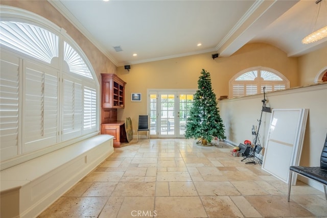 exercise room featuring crown molding and french doors