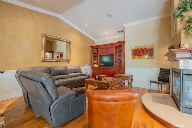 living room with crown molding, a multi sided fireplace, wood-type flooring, and lofted ceiling