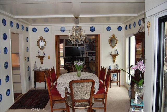 dining space with beamed ceiling, carpet flooring, and an inviting chandelier