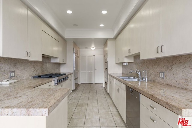 kitchen with stainless steel gas stovetop, black dishwasher, sink, and decorative backsplash