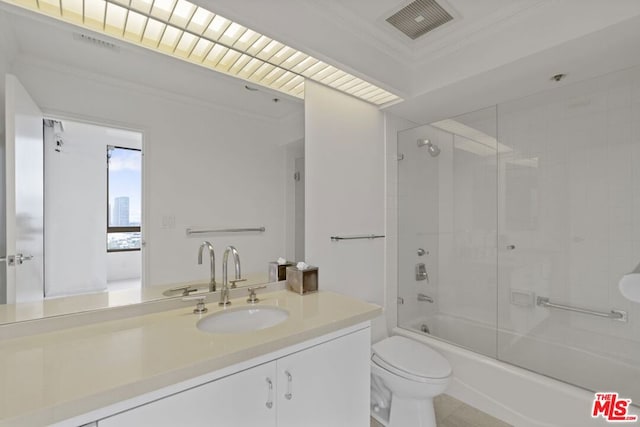 full bathroom featuring crown molding, vanity, toilet, and shower / bathing tub combination