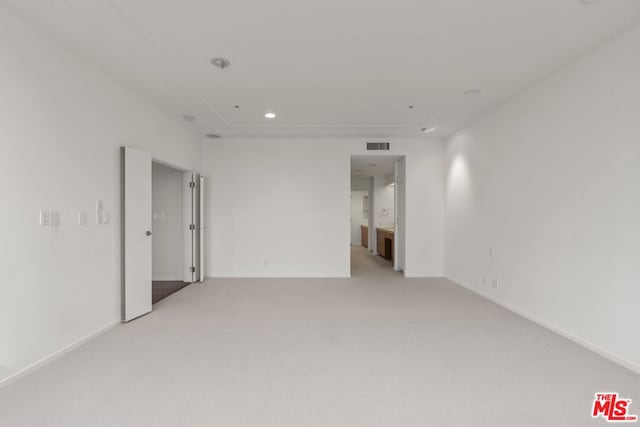 empty room featuring light colored carpet