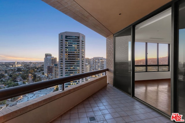 view of balcony at dusk