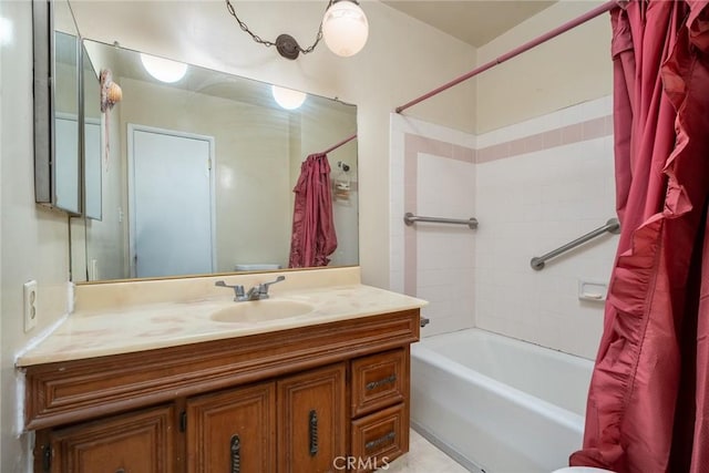 bathroom featuring vanity and shower / bathtub combination with curtain