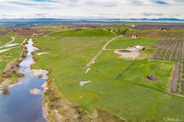 bird's eye view with a water view and a rural view