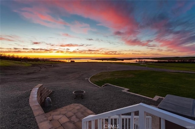 yard at dusk with a patio