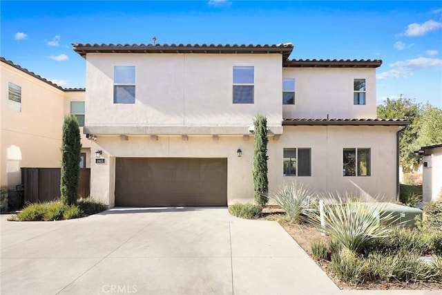 mediterranean / spanish-style house featuring a garage