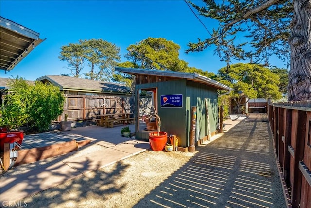 exterior space with a storage shed