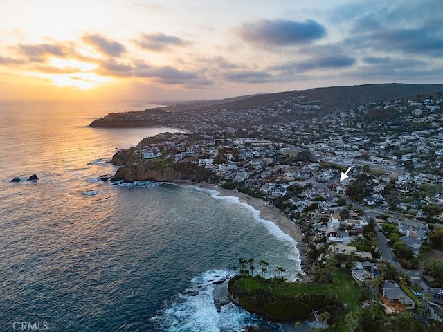 aerial view at dusk with a water view