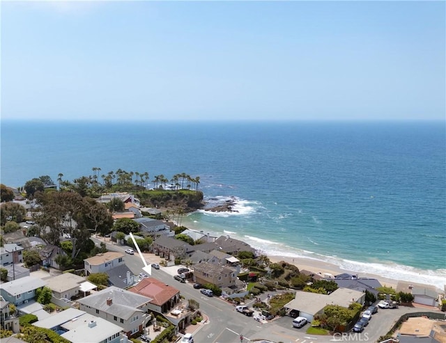 aerial view with a water view and a view of the beach