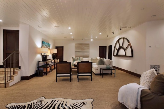 carpeted living room with wooden ceiling