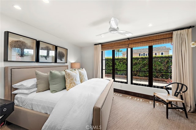 bedroom with ceiling fan and carpet flooring