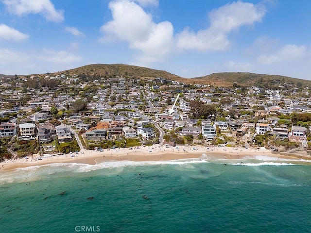 bird's eye view featuring a water and mountain view and a view of the beach