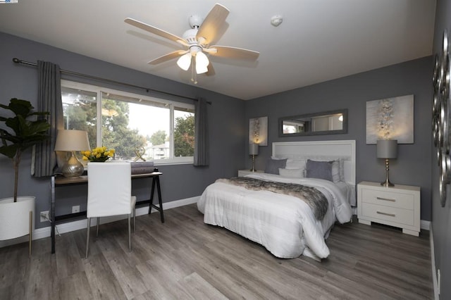 bedroom featuring hardwood / wood-style floors and ceiling fan