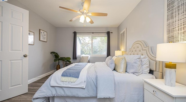 bedroom featuring dark wood-type flooring and ceiling fan