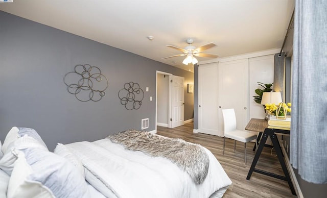 bedroom featuring wood-type flooring and ceiling fan