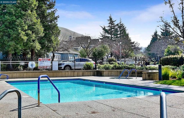 view of pool with a mountain view