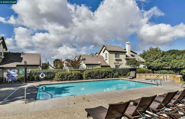 view of swimming pool featuring a patio area