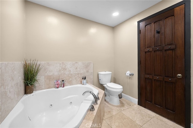 bathroom with tiled bath, tile patterned floors, and toilet