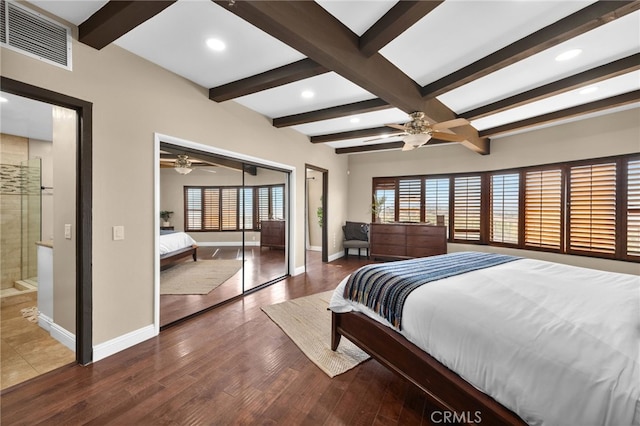 bedroom with hardwood / wood-style flooring, beamed ceiling, a closet, and ceiling fan