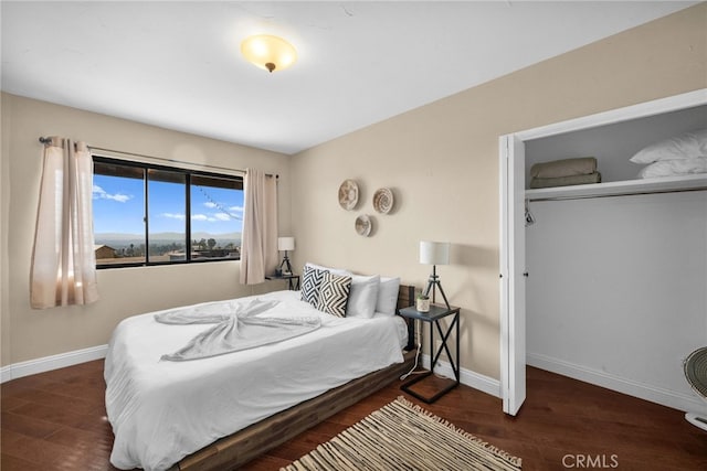 bedroom featuring dark hardwood / wood-style flooring