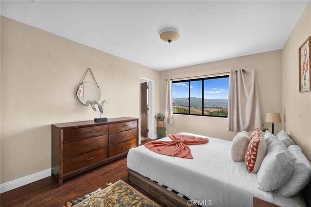 bedroom featuring dark hardwood / wood-style floors