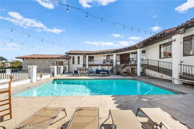 view of swimming pool featuring a patio area