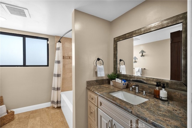 bathroom featuring shower / bathtub combination with curtain and vanity