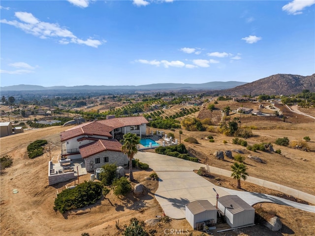 birds eye view of property with a mountain view