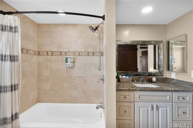 bathroom featuring vanity and shower / bath combo with shower curtain