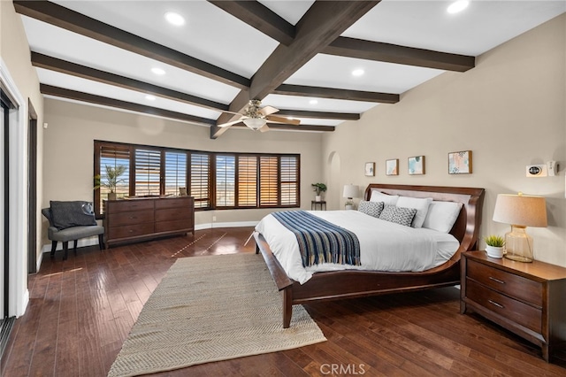 bedroom featuring dark hardwood / wood-style flooring, beamed ceiling, and ceiling fan