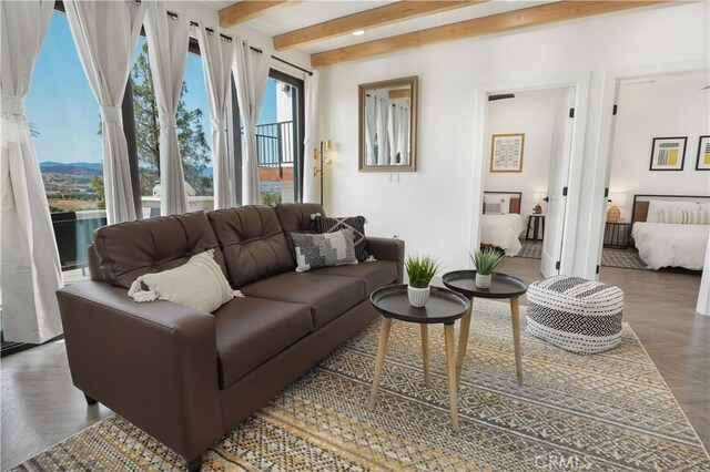 living room featuring dark parquet floors and beam ceiling