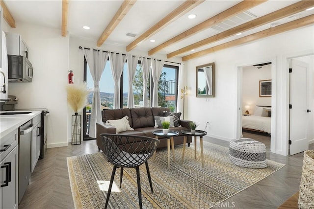 living room featuring beam ceiling and dark parquet floors