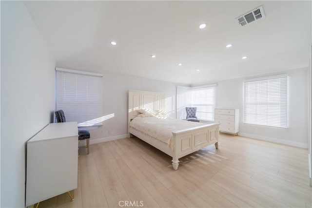 bedroom with light hardwood / wood-style floors