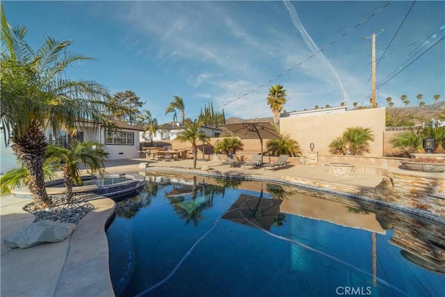 view of swimming pool with a patio area