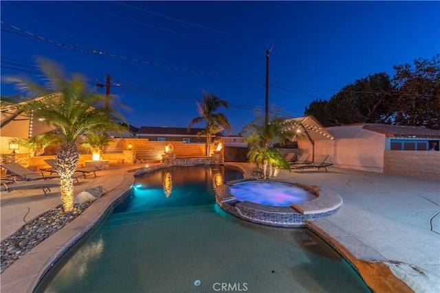 view of swimming pool featuring an in ground hot tub and a patio area