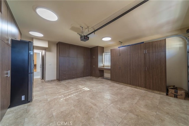 interior space featuring stainless steel refrigerator