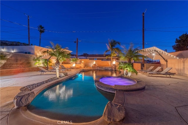 view of swimming pool with a patio and an in ground hot tub