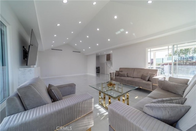 living room featuring high vaulted ceiling