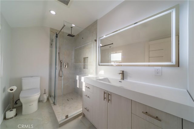 bathroom featuring vanity, an enclosed shower, and toilet