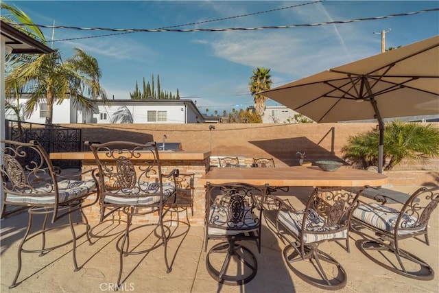 view of patio featuring a bar