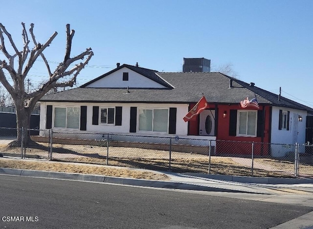 single story home featuring central AC unit