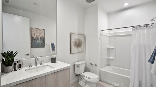 full bathroom with toilet, tile patterned floors, shower / bathtub combination with curtain, and vanity