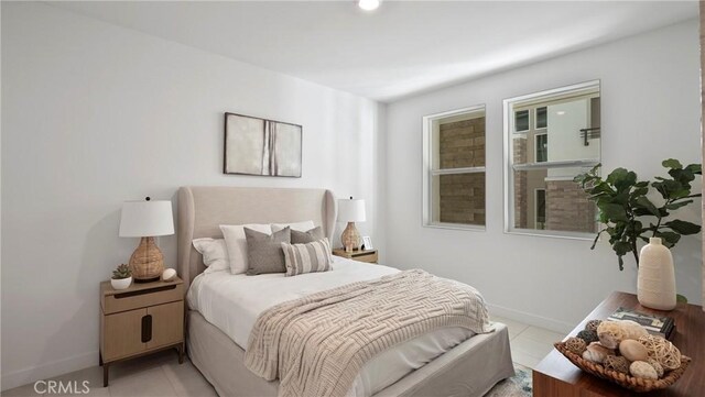 bedroom featuring light tile patterned floors