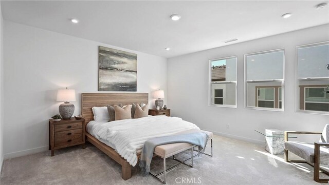 bedroom featuring light colored carpet