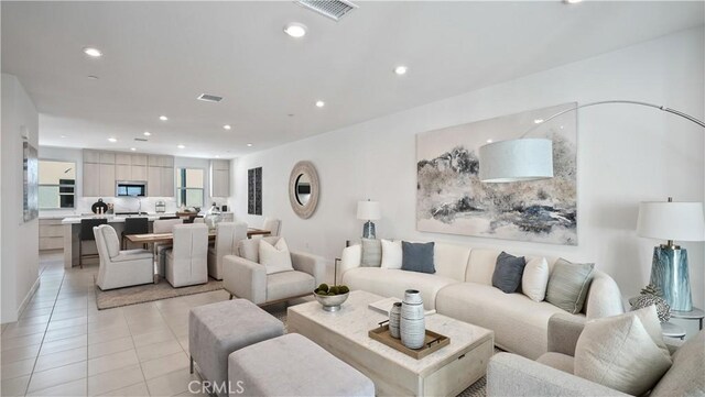 living room with light tile patterned flooring