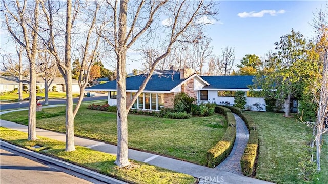 single story home with a front yard