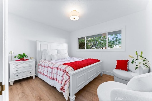 bedroom with light hardwood / wood-style floors